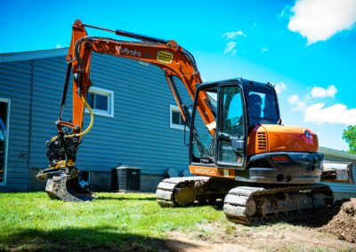 Close-up of excavator bucket digging soil