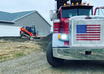 Dump truck delivering gravel to construction site