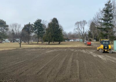 Heavy machinery grading rough terrain