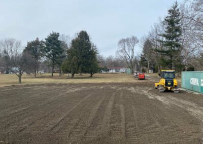 Heavy machinery grading rough terrain