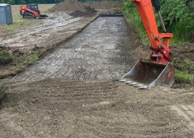 Close-up of excavator bucket digging soil