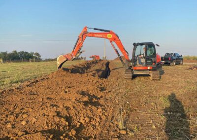 Land clearing equipment removing trees and brush